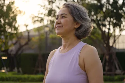 A person sitting calmly outdoors